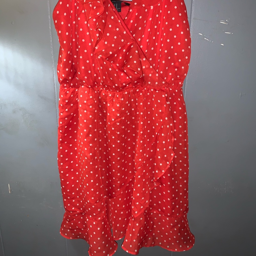 Spaghetti strap red dress with white polka dots.